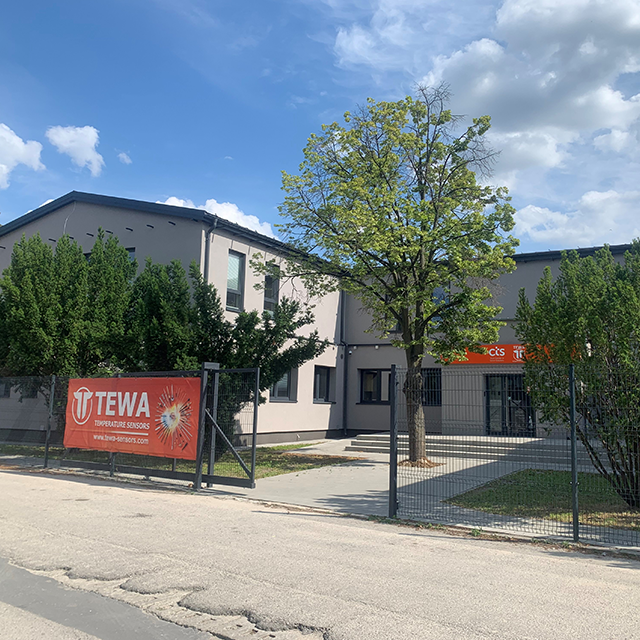 CTS facility with CTS|TEWA banner and greenery located in Lublin, Poland