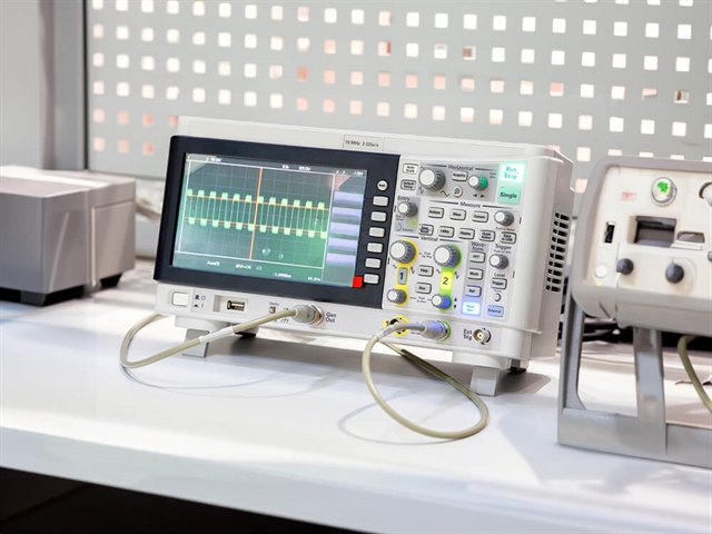 Oscilloscope on table with measuring equipment