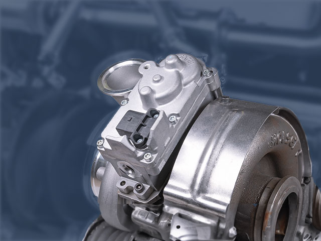 CTS actuator mounted to a diesel turbocharger with a blue background