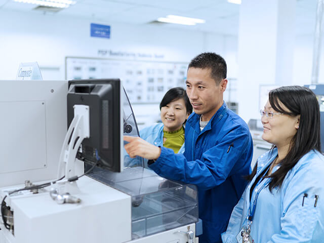 Team working in front of computer