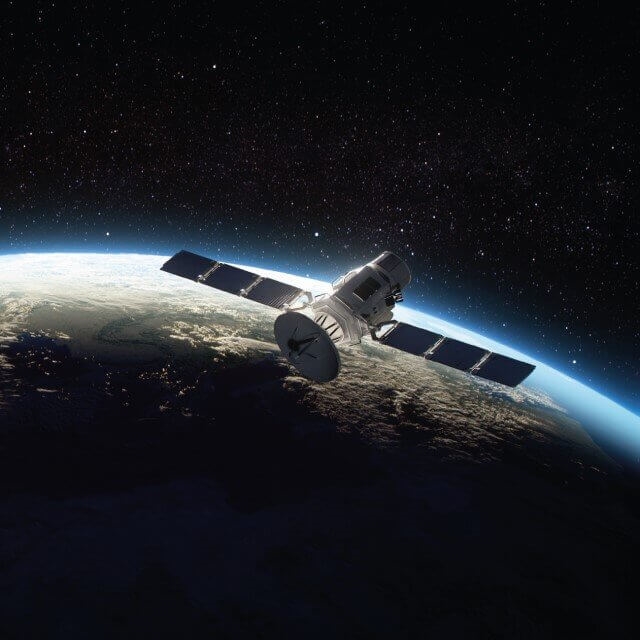 Satellite in outer space orbiting the earth
