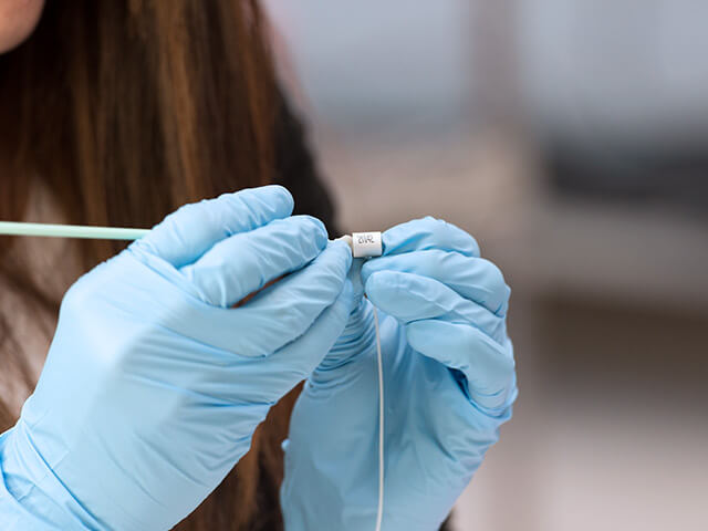 Woman handling piezoelectric component